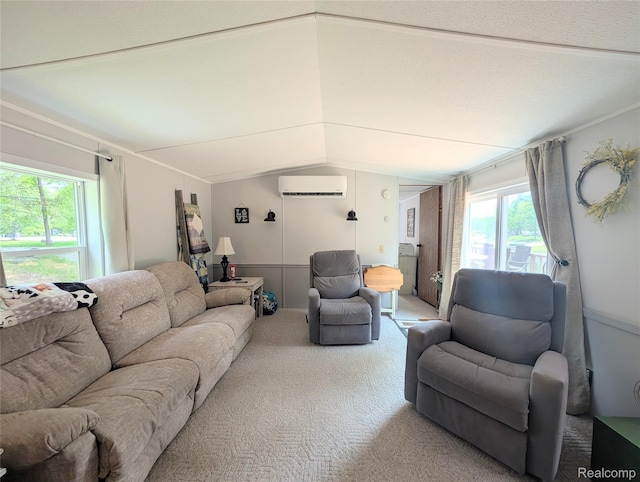 3730 Pinelands Rd, Gladwin, MI 48624 - living area with a wall unit AC, lofted ceiling, light carpet, and plenty of natural light
