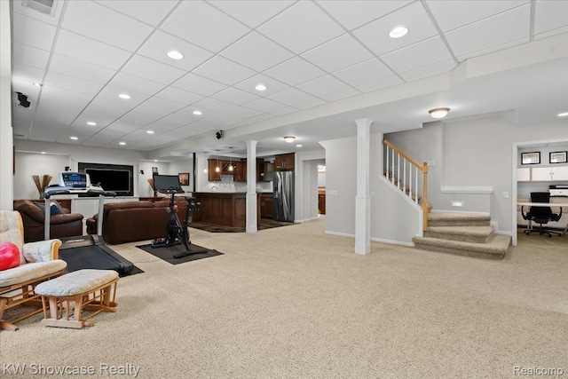 1307 Trillium Ct, Wixom, MI 48393 - carpeted living room featuring stairway, a drop ceiling, and recessed lighting