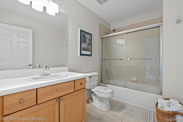 1307 Trillium Ct, Wixom, MI 48393 - bathroom featuring tile patterned floors, vanity, and shower / bath combination with glass door