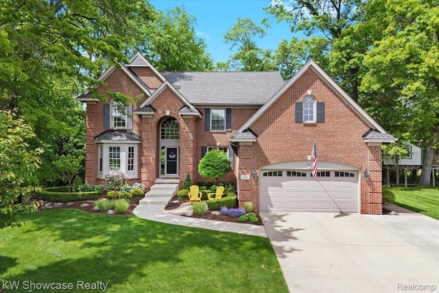 1307 Trillium Ct, Wixom, MI 48393 - traditional-style home with driveway, an attached garage, a front yard, and brick siding