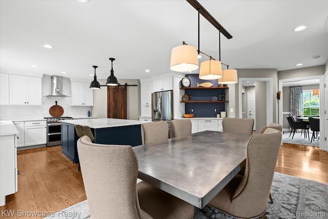 1307 Trillium Ct, Wixom, MI 48393 - dining area featuring light wood finished floors and recessed lighting