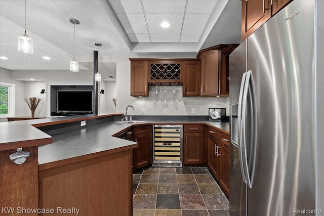 1307 Trillium Ct, Wixom, MI 48393 - kitchen featuring stainless steel fridge, beverage cooler, decorative light fixtures, dark stone finish flooring, and dark countertops