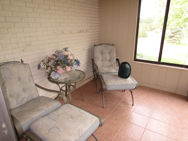 9920 Camridge Ct, South Lyon, MI 48178 - sitting room featuring light tile patterned floors and baseboards