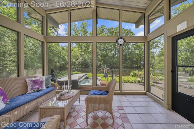 30239 Hickory Ln, Franklin, MI 48025 - sunroom featuring vaulted ceiling, outdoor lounge area, and view of wooded area