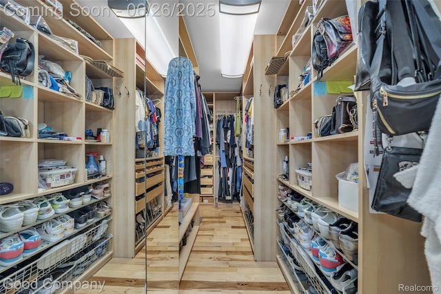 30239 Hickory Ln, Franklin, MI 48025 - walk in closet featuring wood finished floors