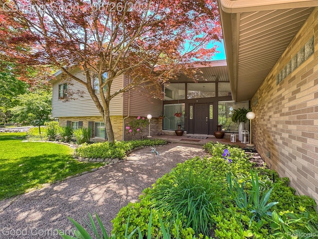 30239 Hickory Ln, Franklin, MI 48025 - doorway to property with a lawn and brick siding