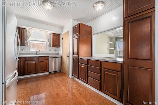 15255 Horger Ave, Allen Park, MI 48101 - kitchen with stainless steel appliances, wood finished floors, and a sink