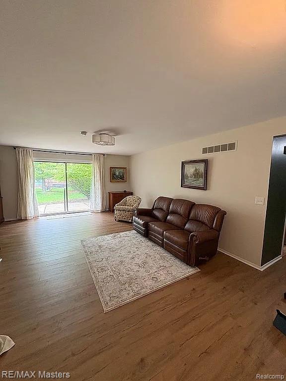 43242 Barchester Rd, Canton, MI 48187 - living area with wood finished floors and baseboards