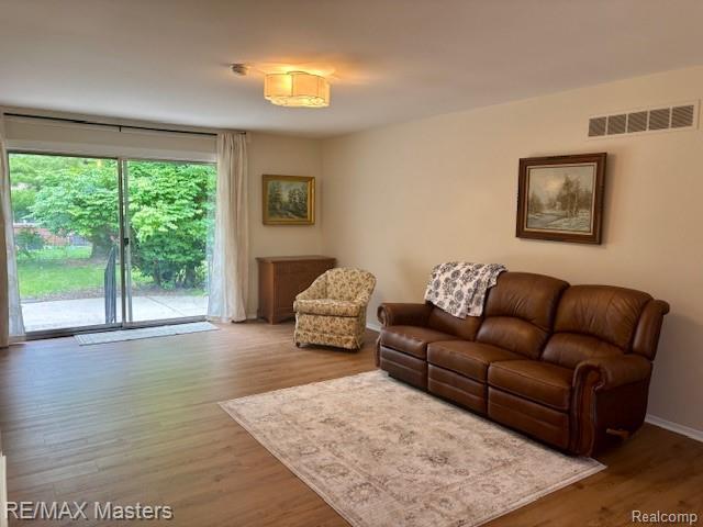 43242 Barchester Rd, Canton, MI 48187 - living area featuring wood finished floors and baseboards