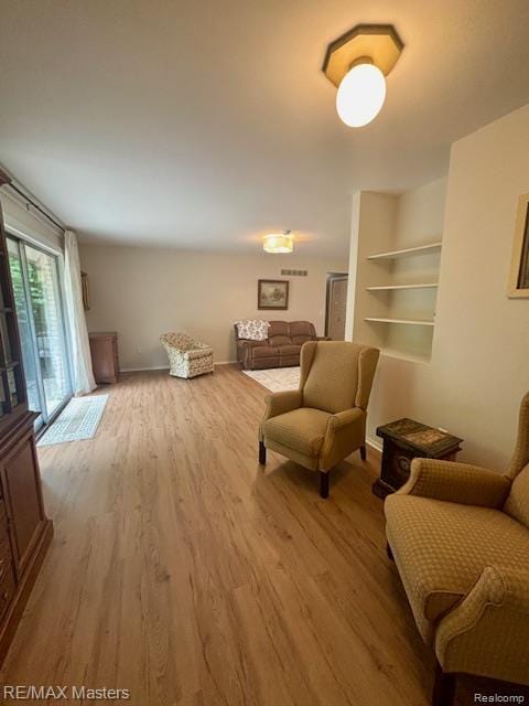 43242 Barchester Rd, Canton, MI 48187 - living area featuring wood finished floors and baseboards