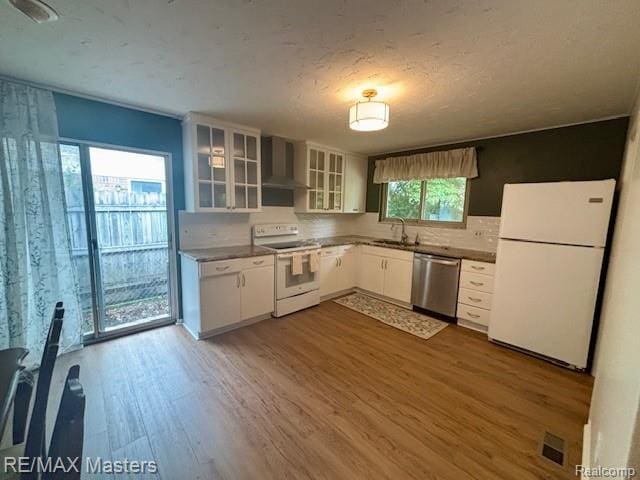 43242 Barchester Rd, Canton, MI 48187 - kitchen featuring white appliances, a sink, dark wood-style floors, wall chimney range hood, and white cabinetry