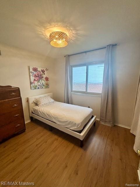 43242 Barchester Rd, Canton, MI 48187 - bedroom with dark wood-style floors and baseboards