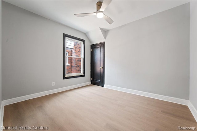 17169 Griggs St, Detroit, MI 48221 - empty room with light wood-type flooring, baseboards, a ceiling fan, and vaulted ceiling
