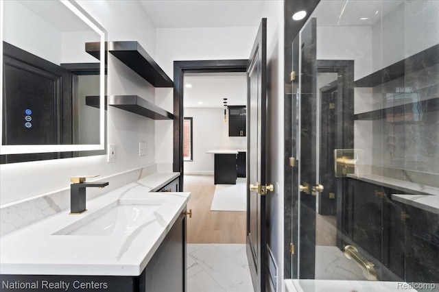 17169 Griggs St, Detroit, MI 48221 - bathroom featuring vanity, a shower stall, marble look tiles, and recessed lighting