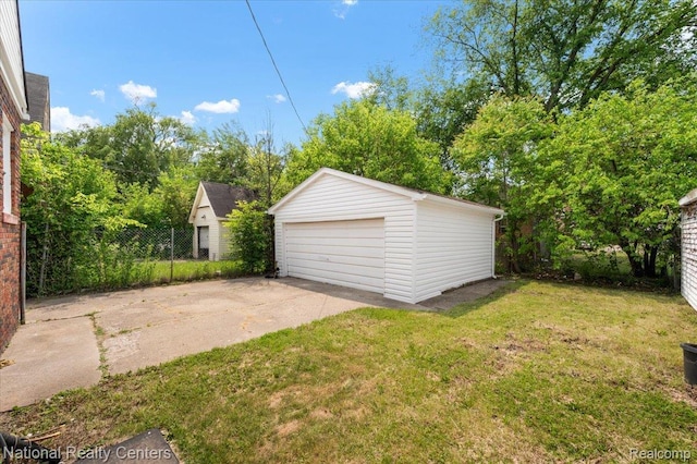 17169 Griggs St, Detroit, MI 48221 - view of green lawn with an outdoor structure and a garage