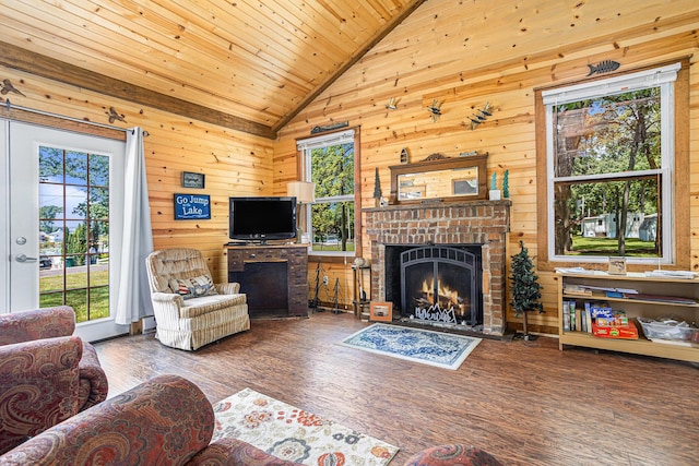 32205 James St, Colon, MI 49040 - living area featuring a fireplace, vaulted ceiling, healthy amount of natural light, wood finished floors, and wooden walls