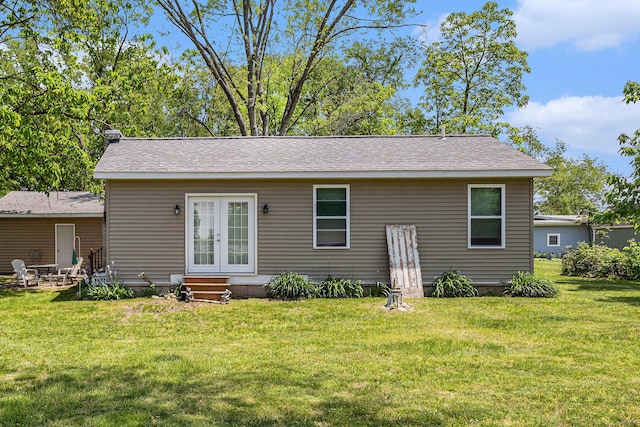 32205 James St, Colon, MI 49040 - rear view of house featuring french doors, a lawn, entry steps, and roof with shingles