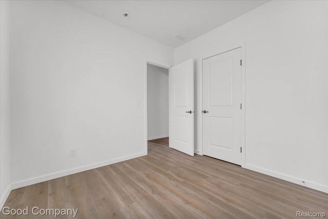 2819 16th St, Detroit, MI 48216 - unfurnished bedroom with wood finished floors and baseboards