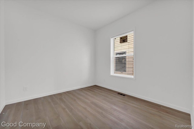 2819 16th St, Detroit, MI 48216 - spare room featuring wood finished floors and baseboards