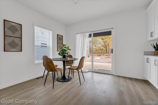 2819 16th St, Detroit, MI 48216 - dining room with light wood finished floors and baseboards