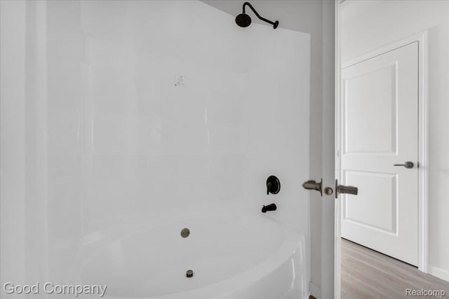 2819 16th St, Detroit, MI 48216 - bathroom featuring wood finished floors and  shower combination
