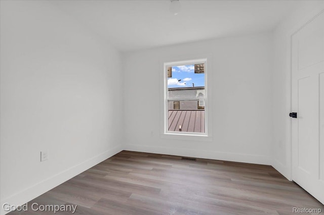 2827 16th St, Detroit, MI 48216 - empty room featuring wood finished floors and baseboards