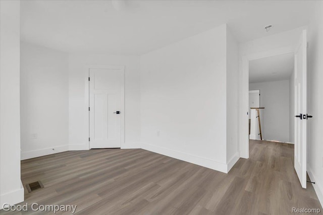 2827 16th St, Detroit, MI 48216 - unfurnished room featuring wood finished floors and baseboards
