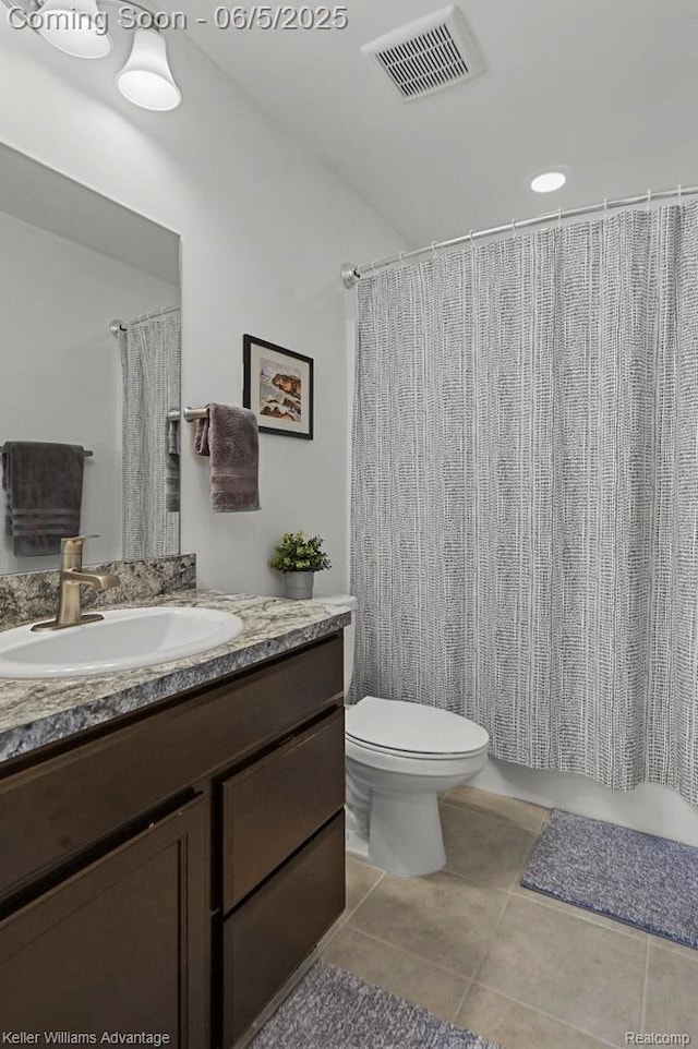 861 N Mill St, South Lyon, MI 48178 - full bath featuring vanity, tile patterned flooring, toilet, and a shower with shower curtain