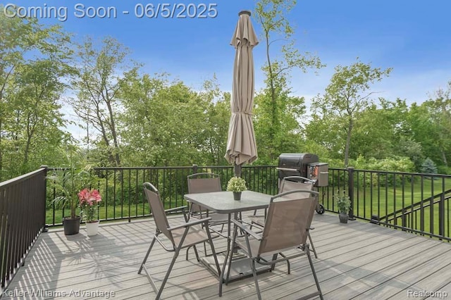 861 N Mill St, South Lyon, MI 48178 - wooden terrace featuring outdoor dining space and view of scattered trees