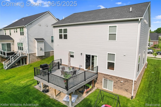 861 N Mill St, South Lyon, MI 48178 - rear view of house featuring a lawn, a deck, and brick siding