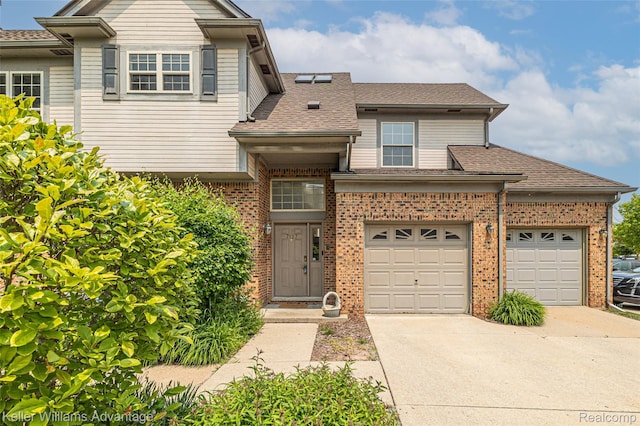 7127 Copper Creek Cir, Canton, MI 48187 - view of front of house with concrete driveway, brick siding, roof with shingles, and a garage