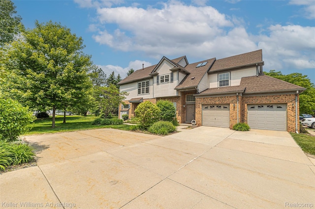 7127 Copper Creek Cir, Canton, MI 48187 - view of front of property featuring driveway, brick siding, a shingled roof, a front lawn, and a garage
