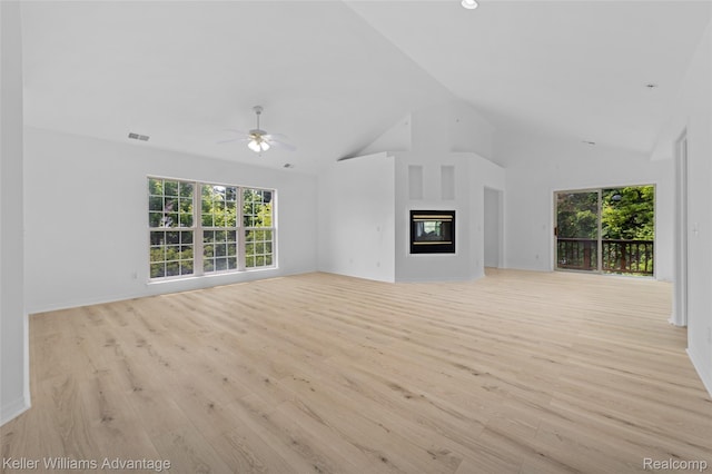 7127 Copper Creek Cir, Canton, MI 48187 - unfurnished living room featuring wood finished floors, a ceiling fan, plenty of natural light, high vaulted ceiling, and recessed lighting