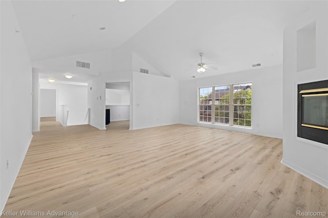 7127 Copper Creek Cir, Canton, MI 48187 - unfurnished living room featuring a multi sided fireplace, a ceiling fan, light wood finished floors, high vaulted ceiling, and baseboards