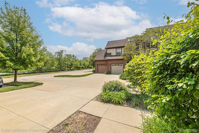 7127 Copper Creek Cir, Canton, MI 48187 - view of home's exterior featuring driveway, brick siding, and a garage