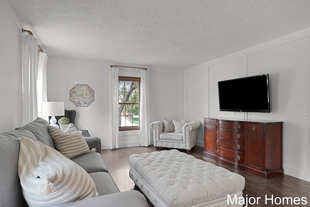 7125 Brooklyn Ave SE, Grand Rapids, MI 49508 - living area with dark wood finished floors, a textured ceiling, and baseboards