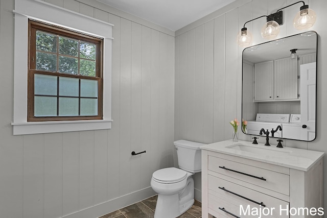7125 Brooklyn Ave SE, Grand Rapids, MI 49508 - half bath with separate washer and dryer, vanity, toilet, and baseboards