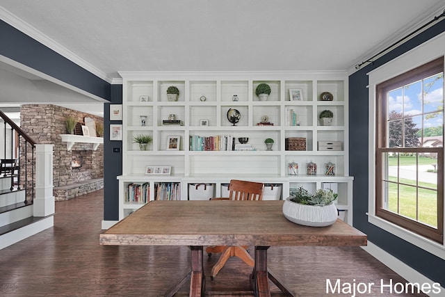 7125 Brooklyn Ave SE, Grand Rapids, MI 49508 - dining area featuring stairs, dark wood finished floors, plenty of natural light, ornamental molding, and built in features