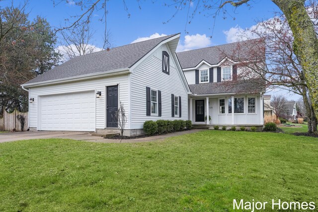 7125 Brooklyn Ave SE, Grand Rapids, MI 49508 - traditional-style house featuring driveway, an attached garage, a front lawn, and roof with shingles