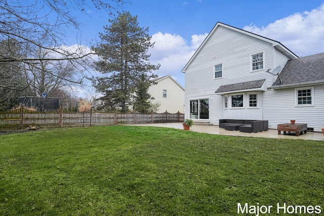 7125 Brooklyn Ave SE, Grand Rapids, MI 49508 - back of property featuring a shingled roof, an outdoor hangout area, and a patio area