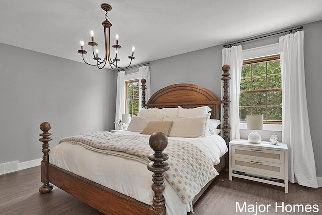 7125 Brooklyn Ave SE, Grand Rapids, MI 49508 - bedroom with a chandelier and wood finished floors