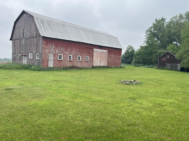 855 E Hansen Rd, Scottville, MI 49454 - view of barn featuring a lawn