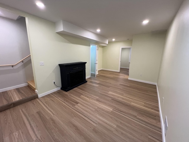855 E Hansen Rd, Scottville, MI 49454 - finished below grade area featuring wood finished floors, baseboards, and recessed lighting