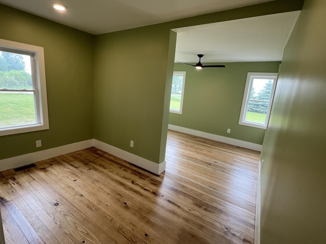 855 E Hansen Rd, Scottville, MI 49454 - empty room featuring healthy amount of natural light, light wood finished floors, a ceiling fan, and recessed lighting