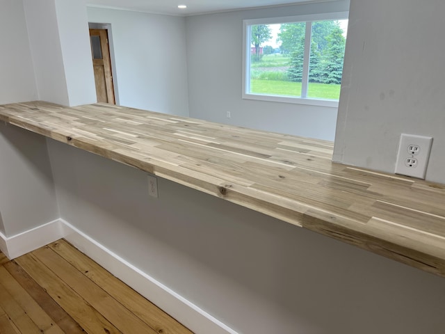 855 E Hansen Rd, Scottville, MI 49454 - interior space with wood finished floors and baseboards