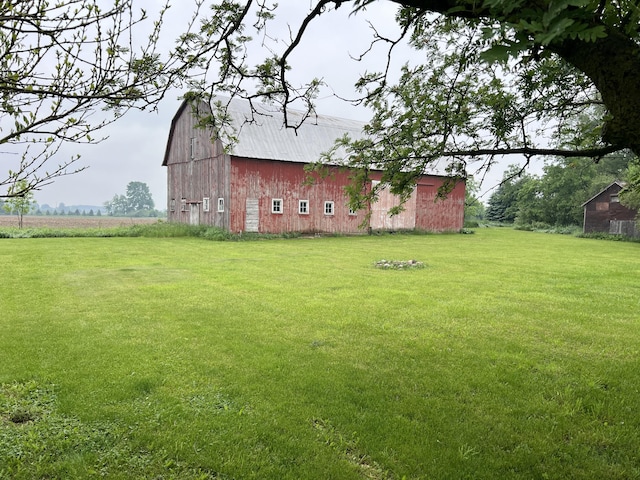 855 E Hansen Rd, Scottville, MI 49454 - view of grassy yard with a barn and an outdoor structure