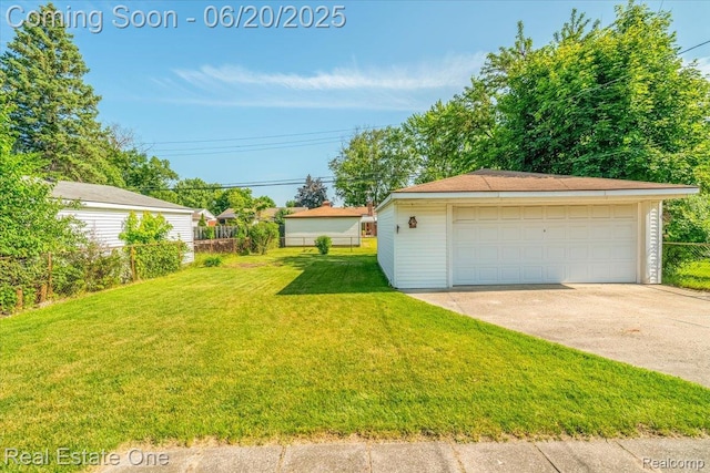 32622 Parkwood St, Westland, MI 48186 - view of grassy yard featuring a detached garage and an outbuilding