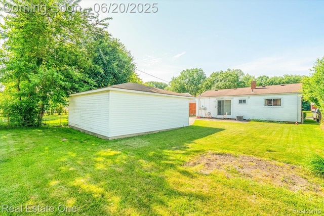 32622 Parkwood St, Westland, MI 48186 - view of green lawn with an outdoor structure