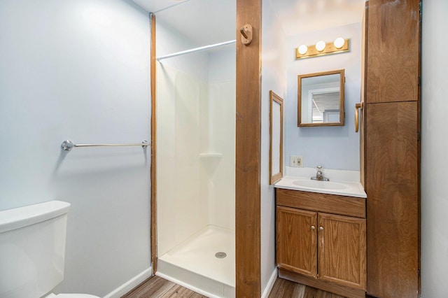 707 Maple St, Big Rapids, MI 49307 - full bathroom with wood finished floors, a shower stall, and baseboards