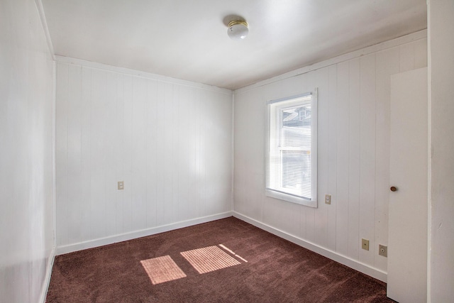 707 Maple St, Big Rapids, MI 49307 - unfurnished room featuring dark carpet and baseboards